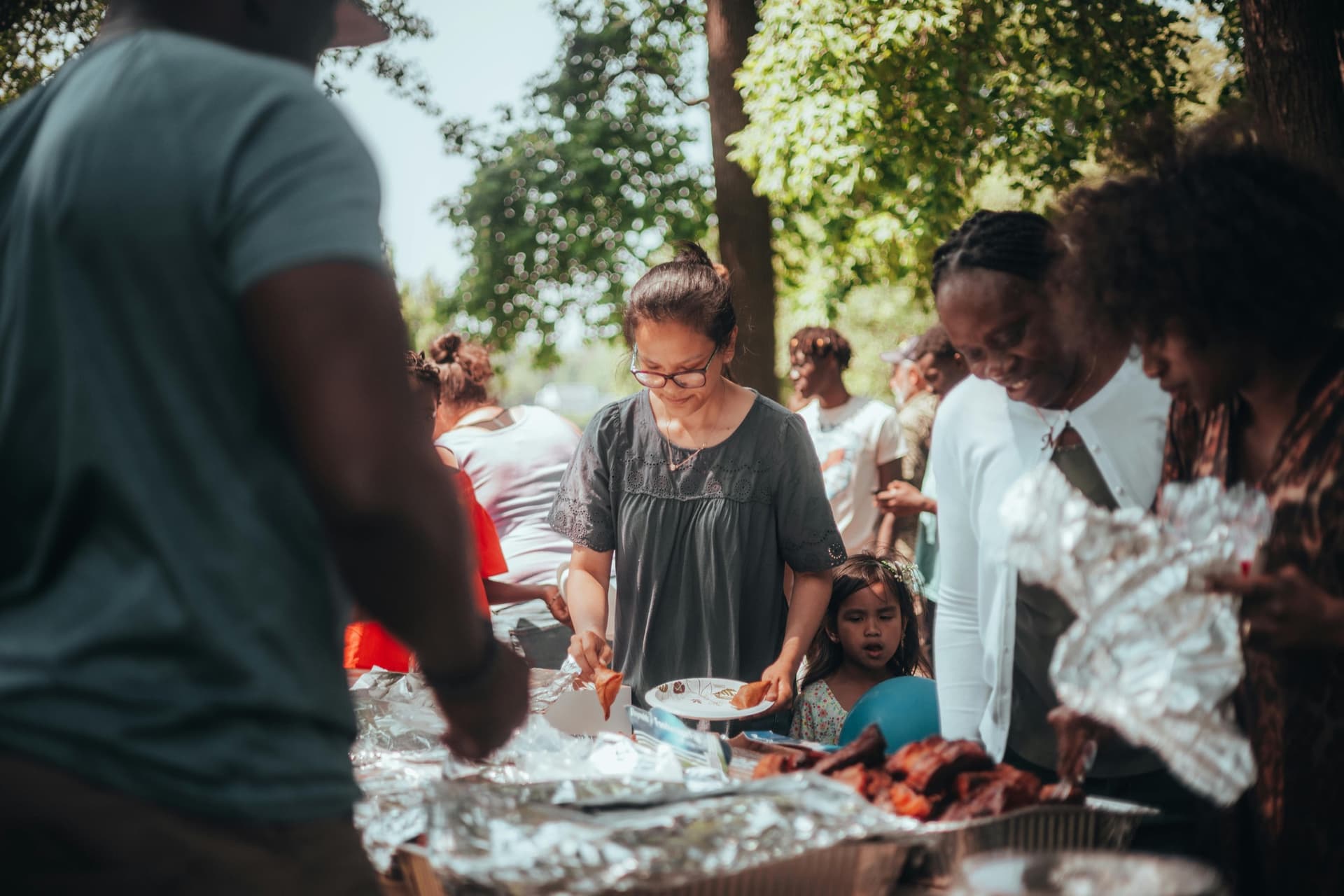 Community members at an outdoor barbecue event
