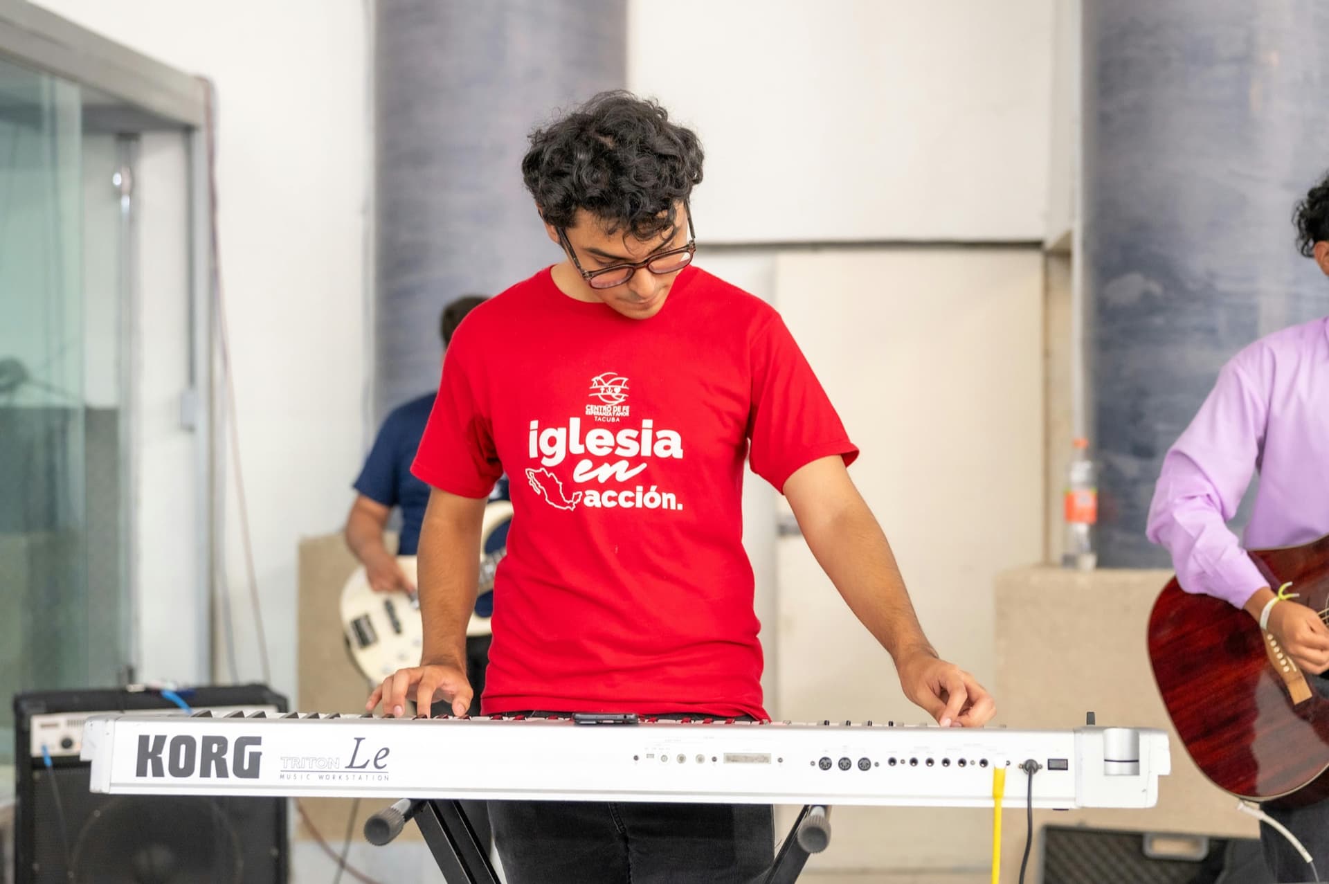 Young man playing keyboard at a church service